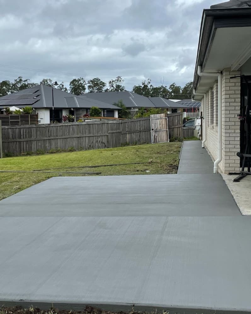 Concrete path running along the side of a house